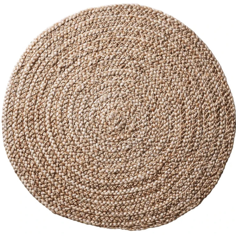A round braided rug made from natural jute or seagrass fibers, shown from a top-down view on a solid white background.