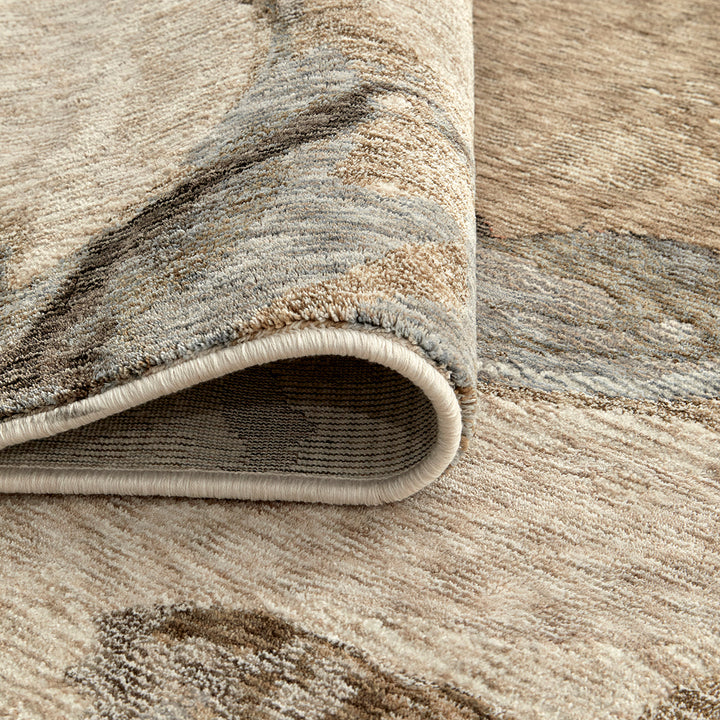Close-up of a textured area rug with neutral colors