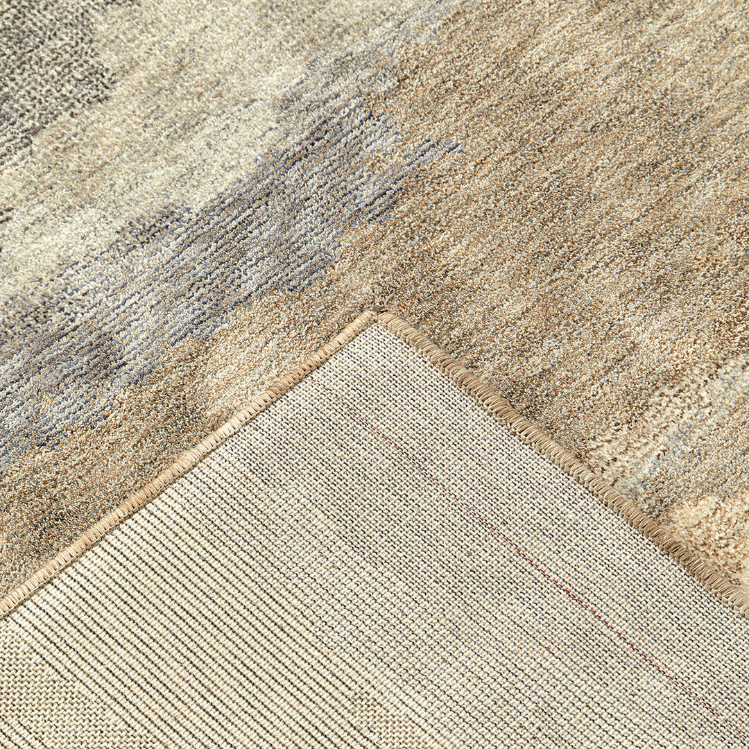 Close-up of a textured beige and brown carpet