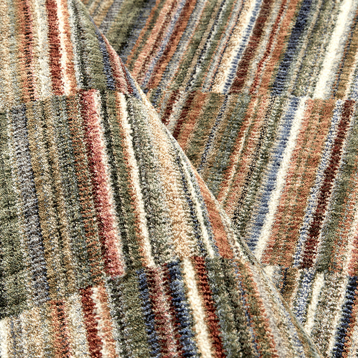 close up of a multi colour striped large rug