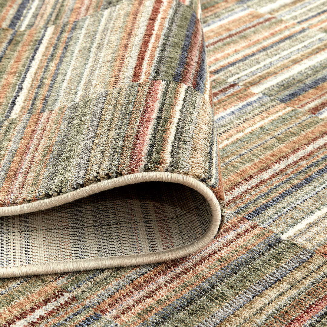 closeup of a cut pile bright striped rug