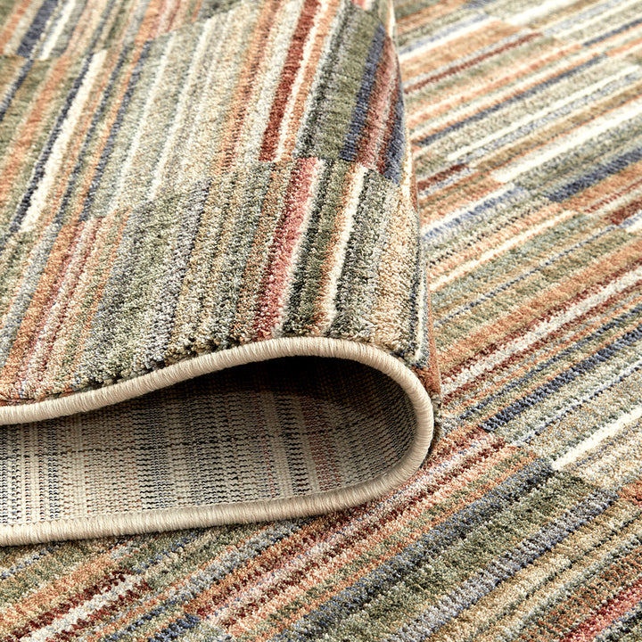 closeup of a cut pile bright striped rug