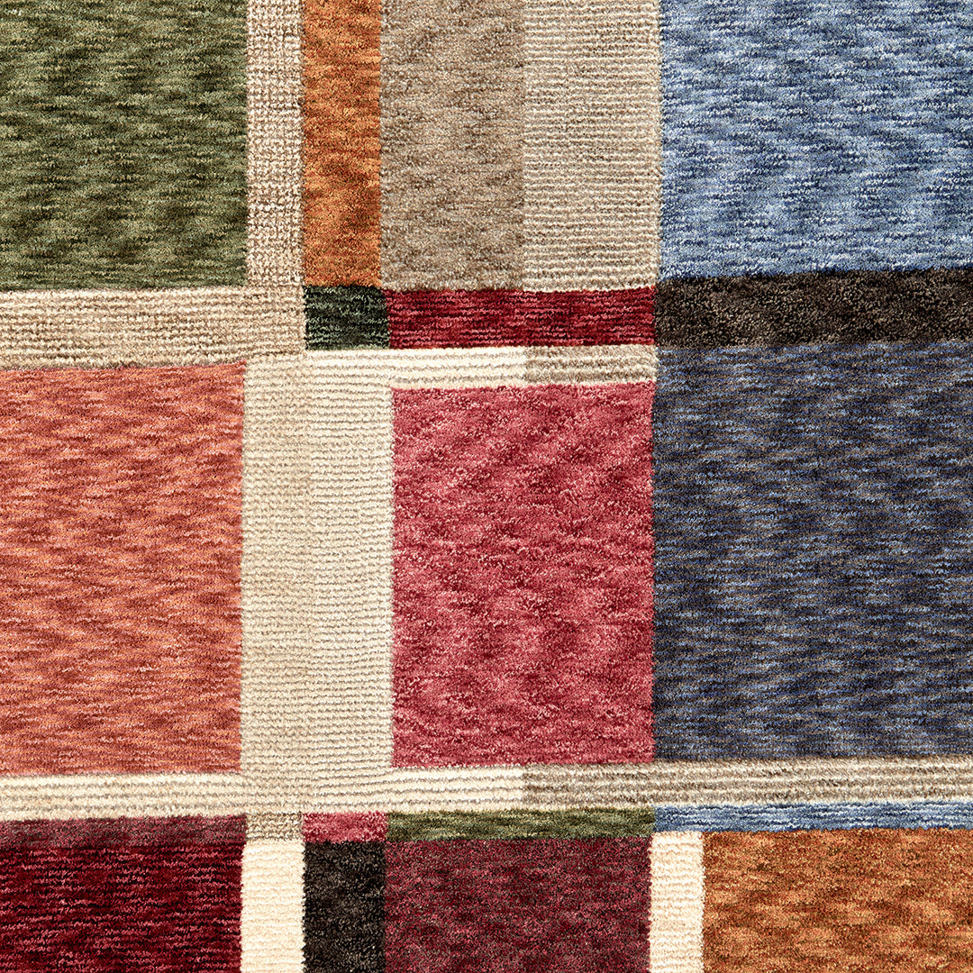 Closeup f a colourful rug with a strong design and cut pile