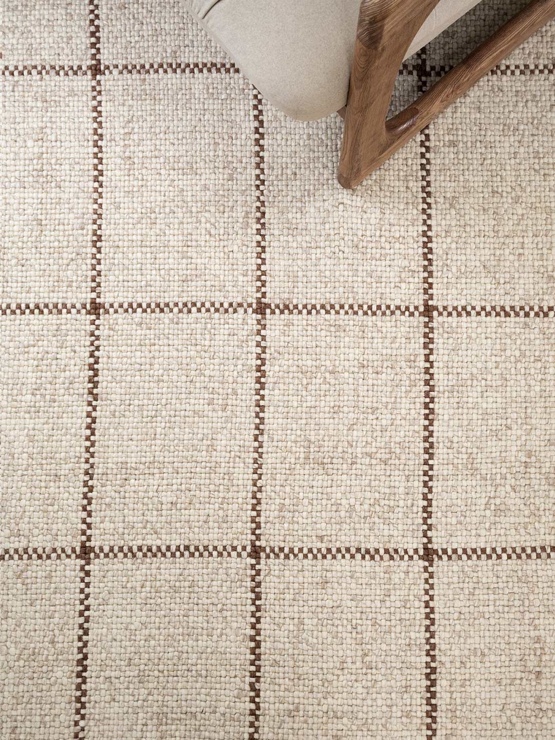 Close-up of a textured rug with a checkered pattern