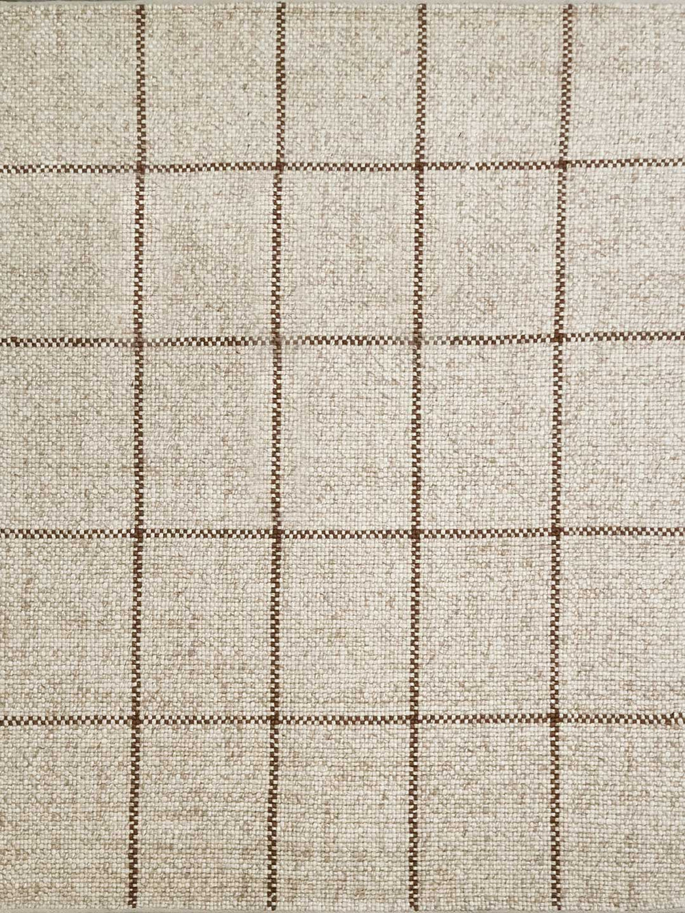 Textured fabric with a checkered pattern in beige and brown tones.