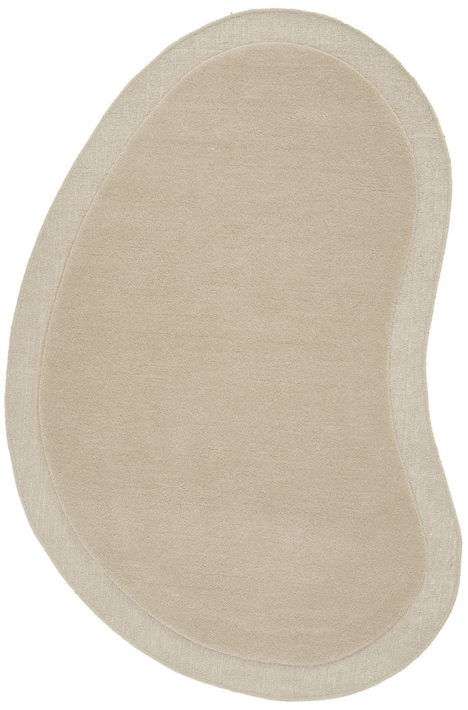 Beige oval-shaped bath mat on a white background