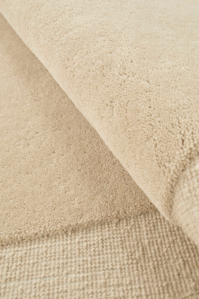 Close-up of beige fabric with a textured pattern