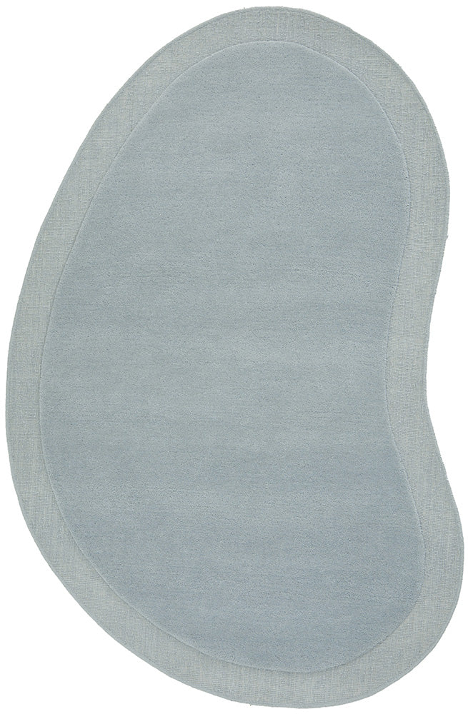 Oval-shaped light gray rug on a white background