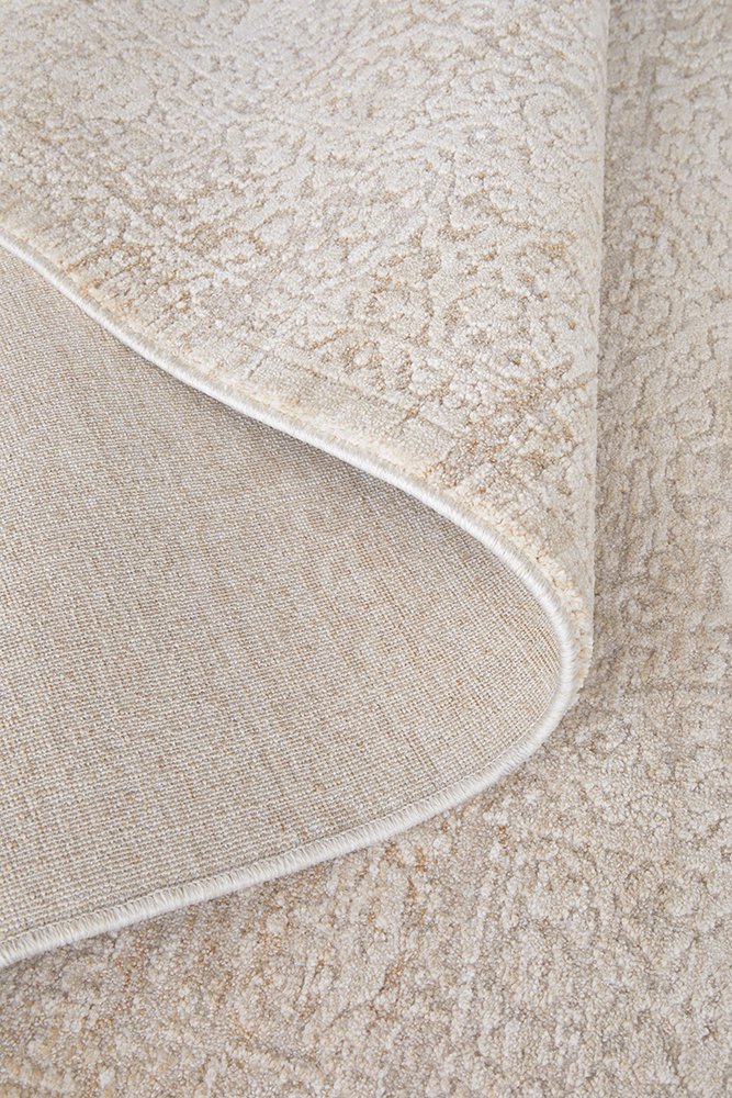 Close-up of a textured beige rug corner
