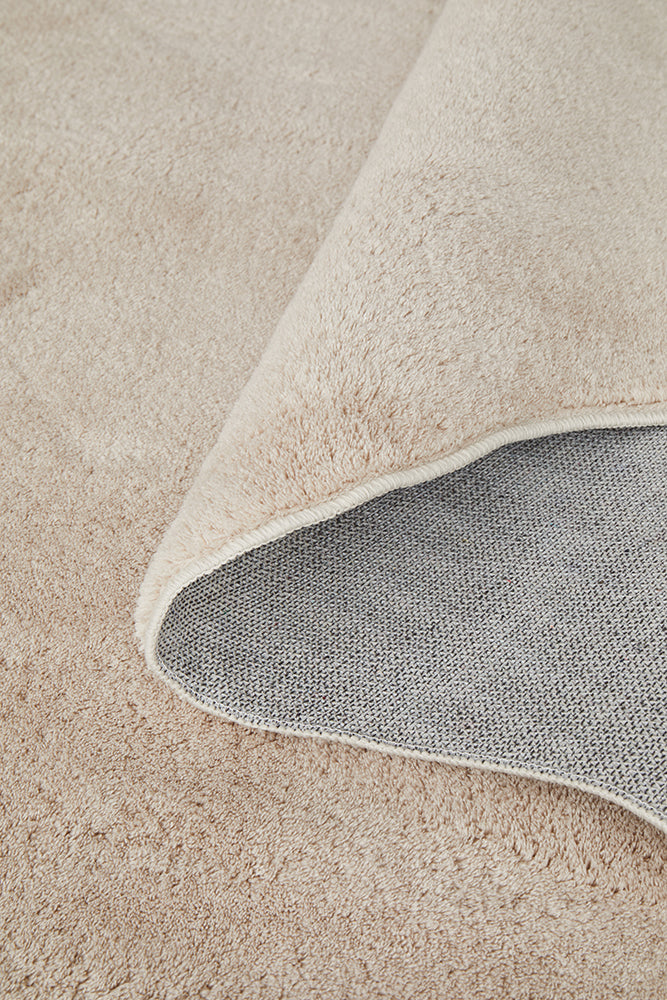 Close-up of a beige hall runner with a textured edge