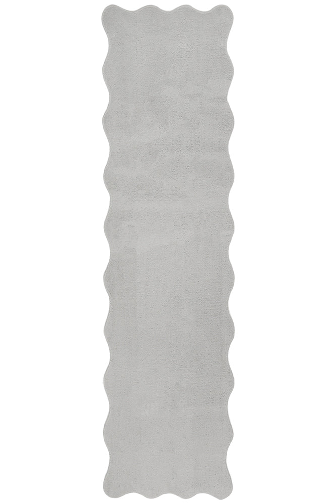 Rectangular gray rug with scalloped edge on a white background hall runner