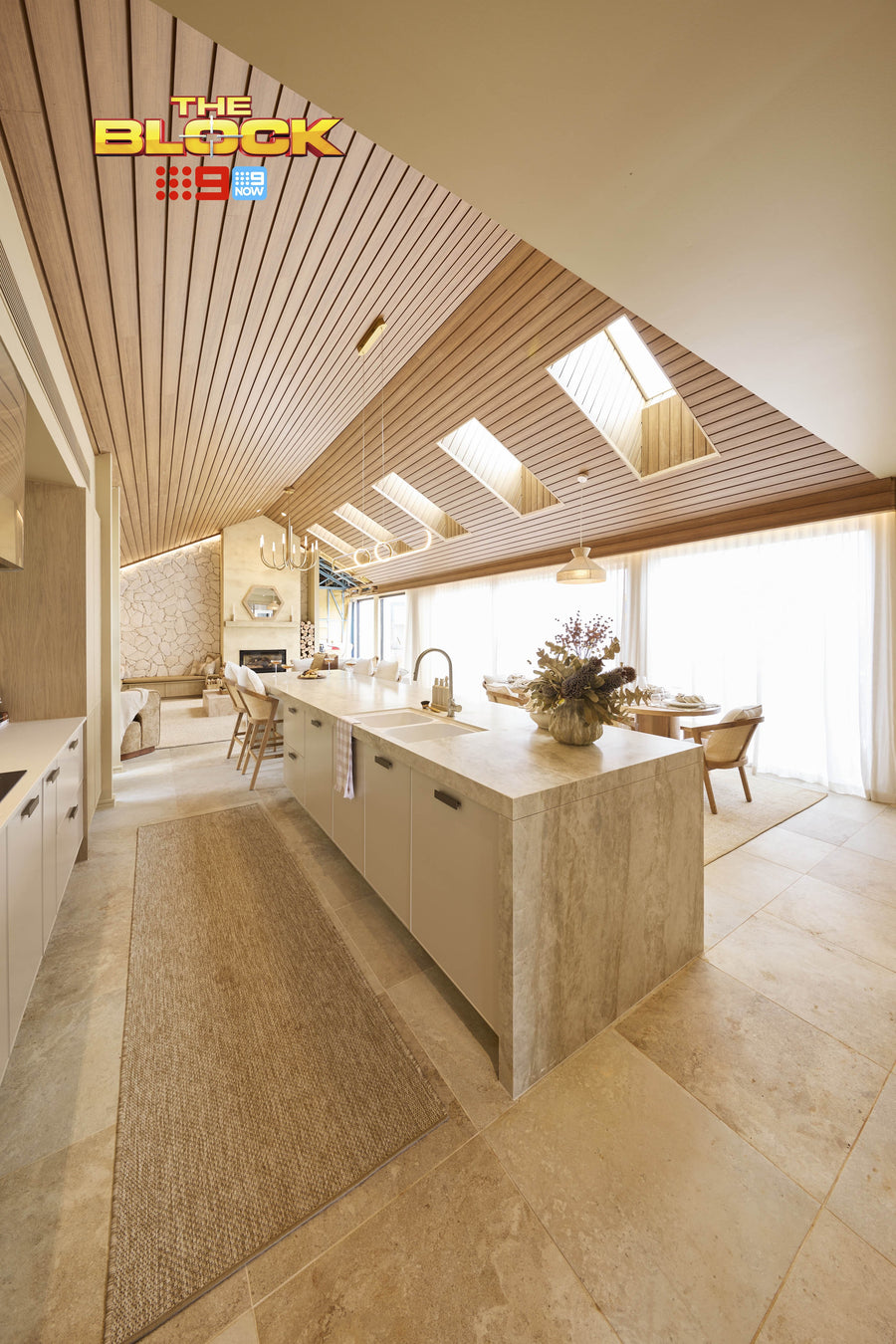 Modern kitchen with marble island and ceiling design, featuring 'The Block' logo. The Block 2025