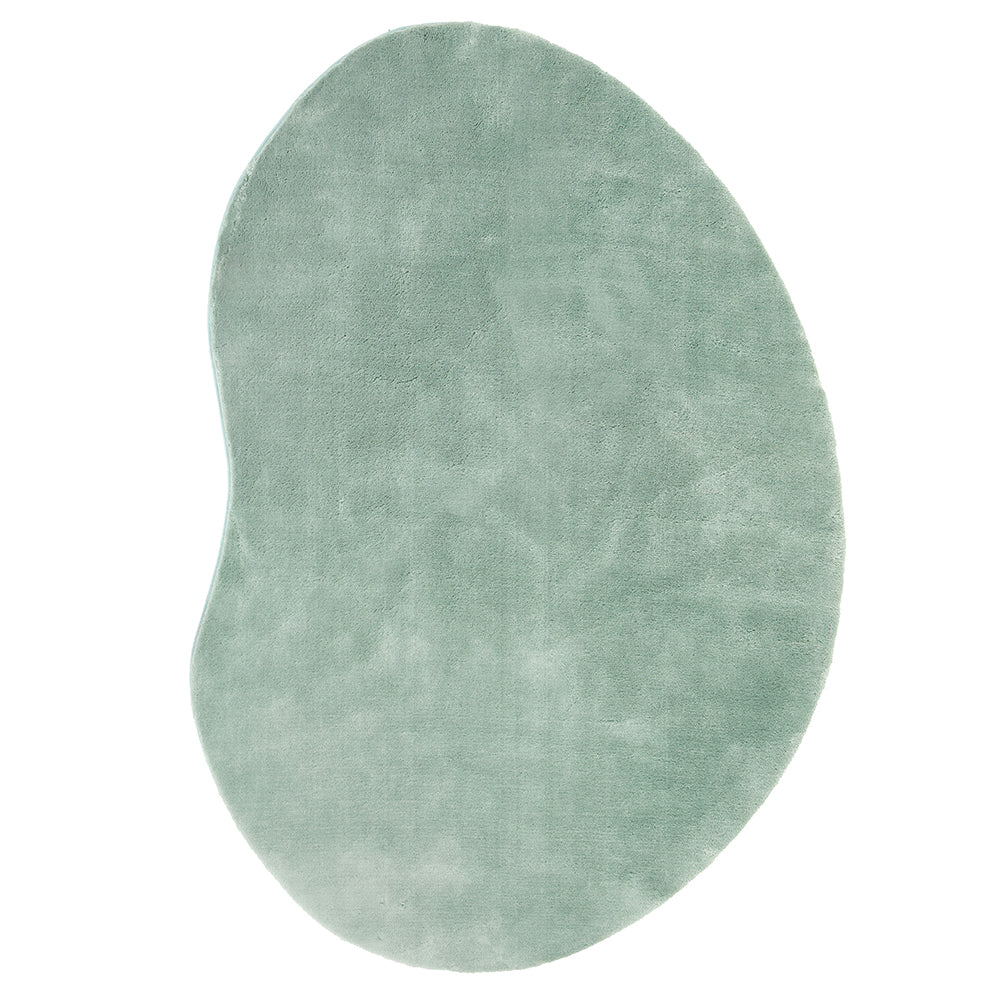 Green oval-shaped rug on a white background