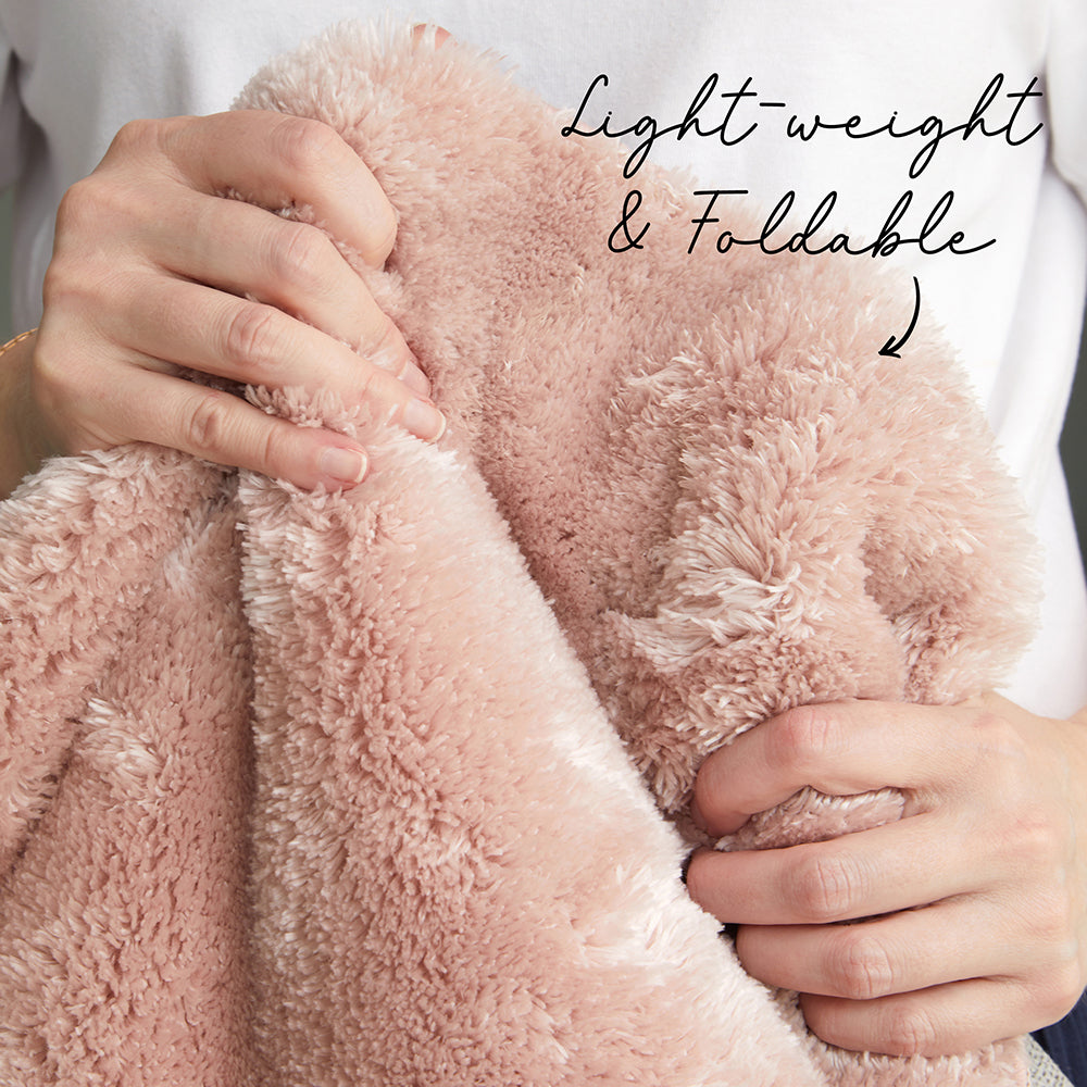 Super soft washable rug held by a lady
