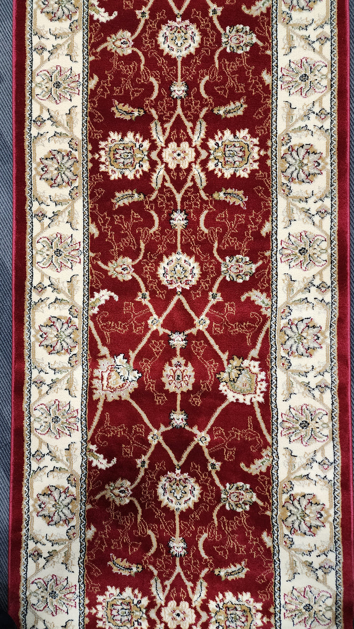 Decorative red and beige rug with intricate patterns hall runner