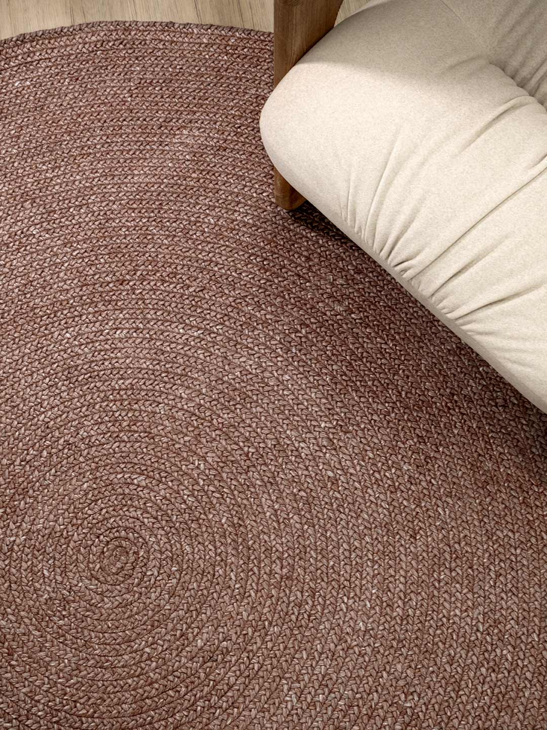 Berry pink textured carpet with a beige couch corner