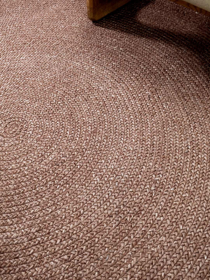 Close-up of berry textured round rug