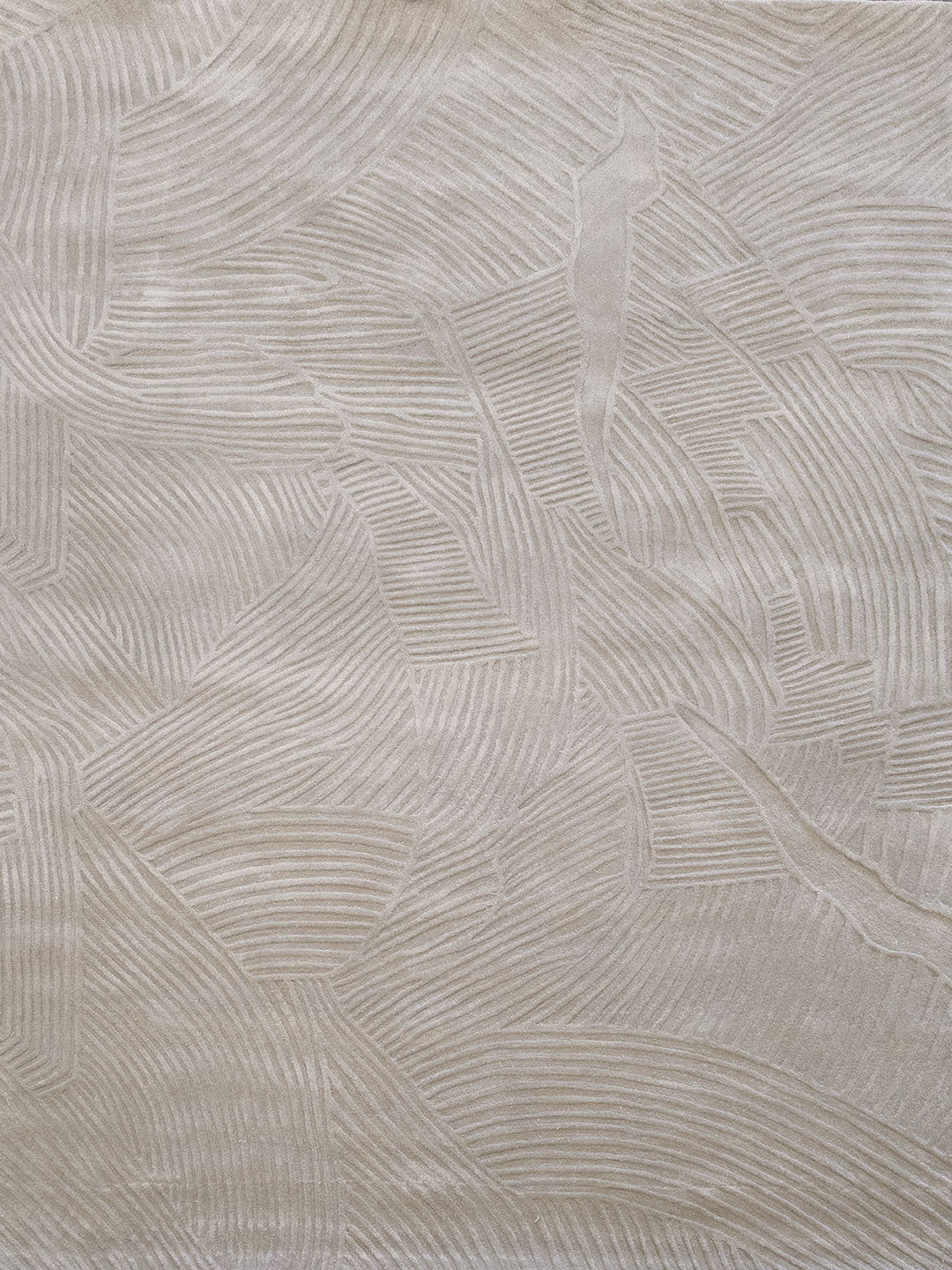 Beige textured fabric with a raised leaf pattern in a tonal cream color.