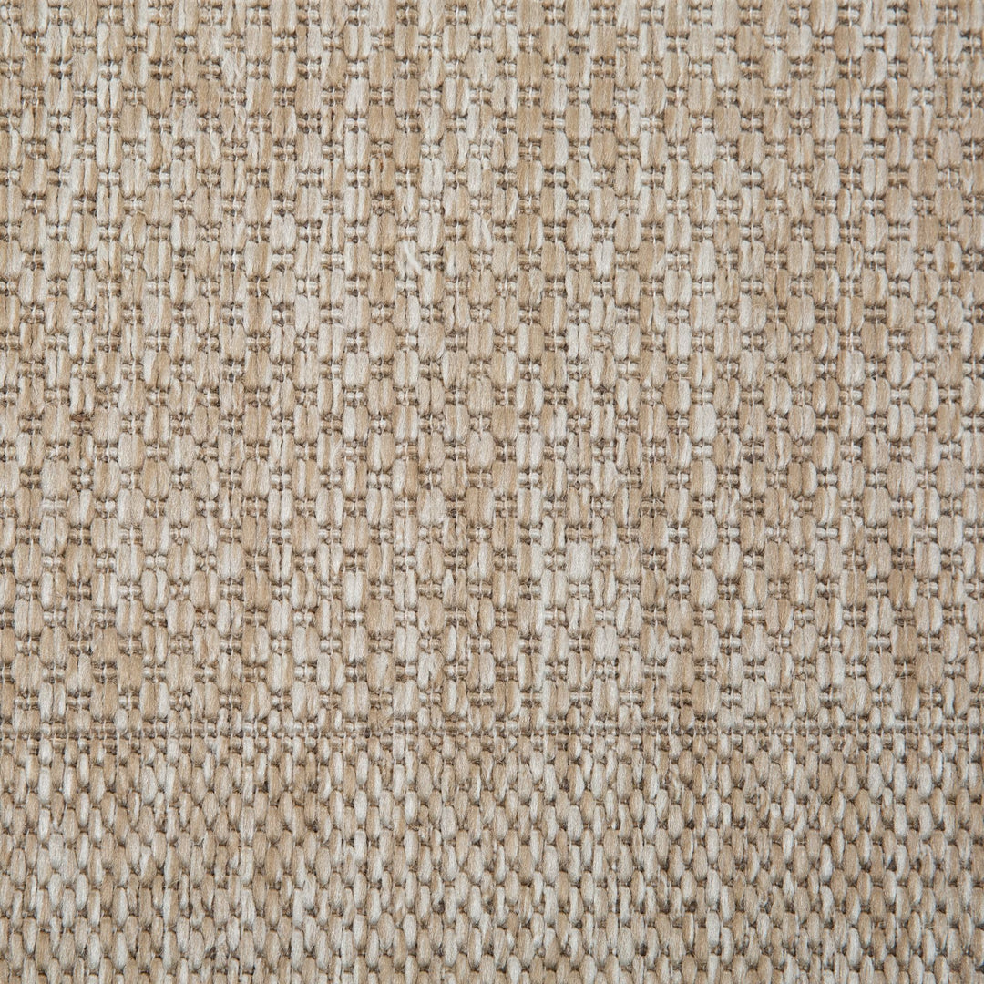 Close-up of a textured beige fabric pattern
