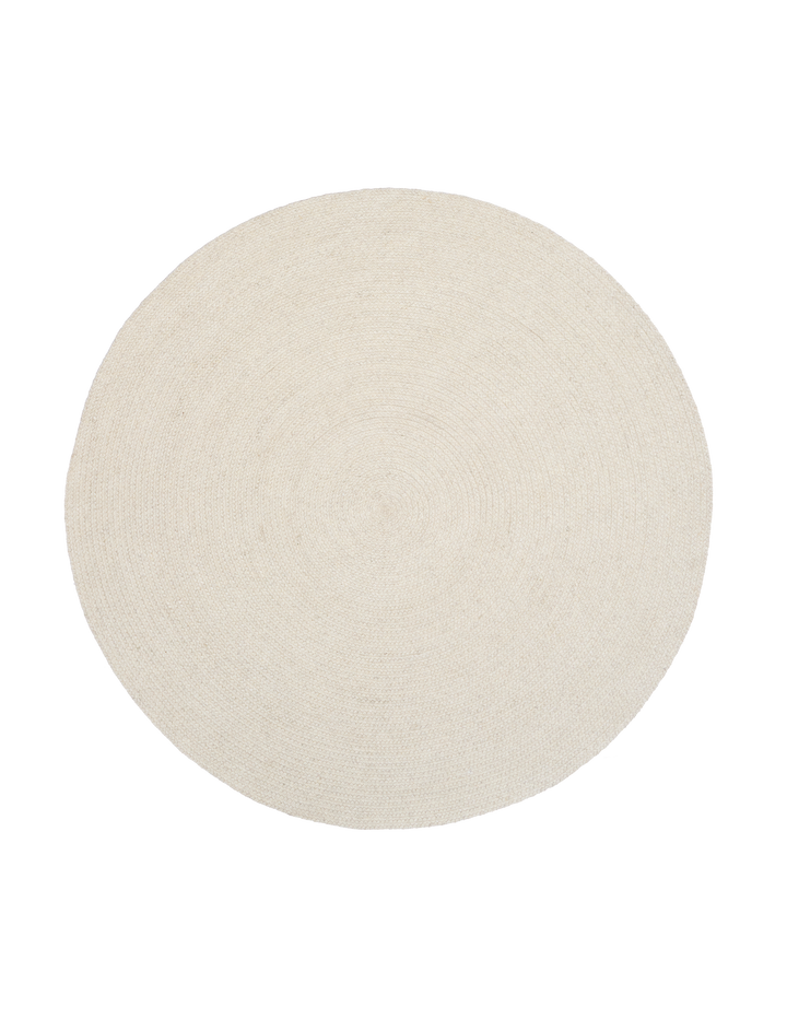 Round beige rug on a white background