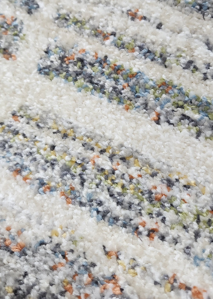Close-up of multicolored sand with a striped pattern