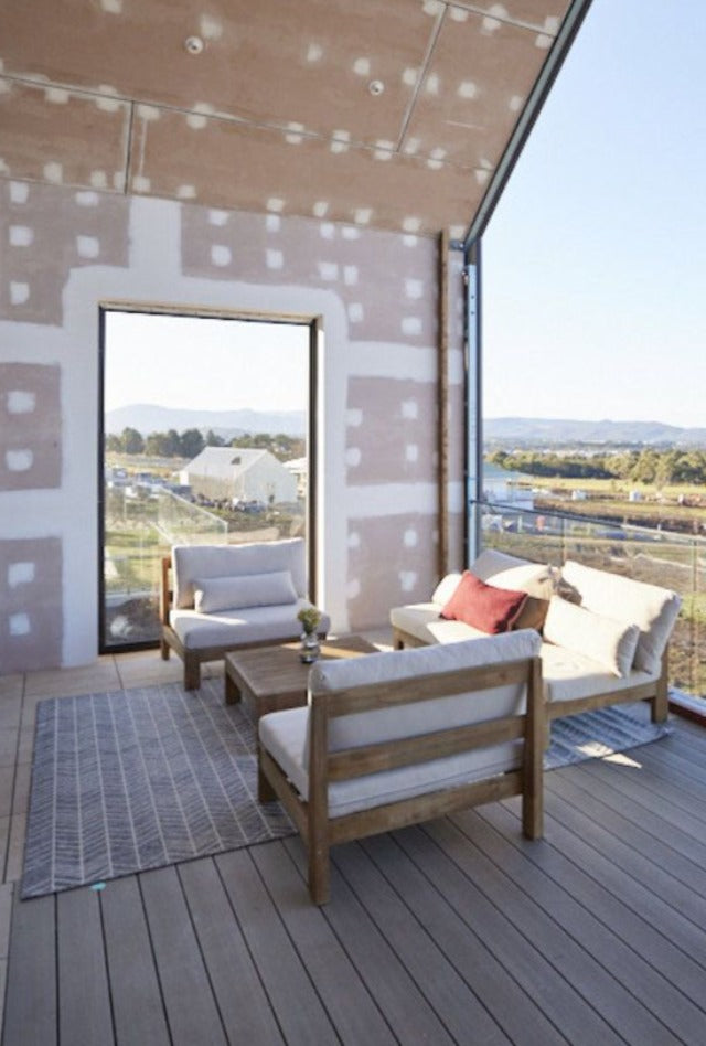 Outdoor Rug with herringbone pattern under outdoor sitting area