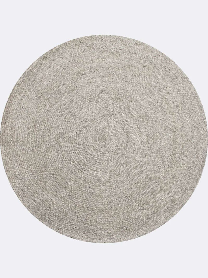 Round gray rug on a white background