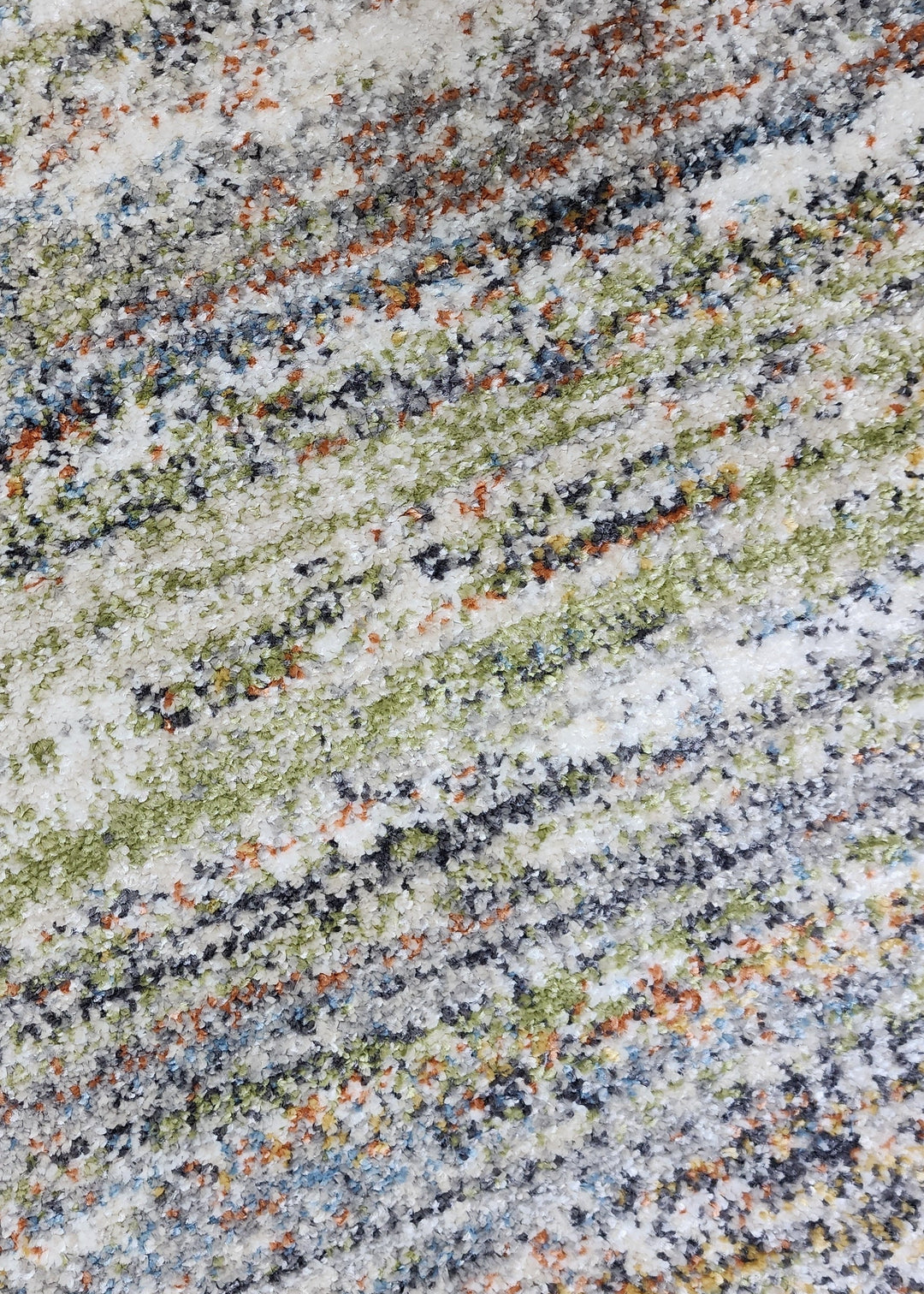 Close-up of a multicolored granite surface with a speckled pattern.