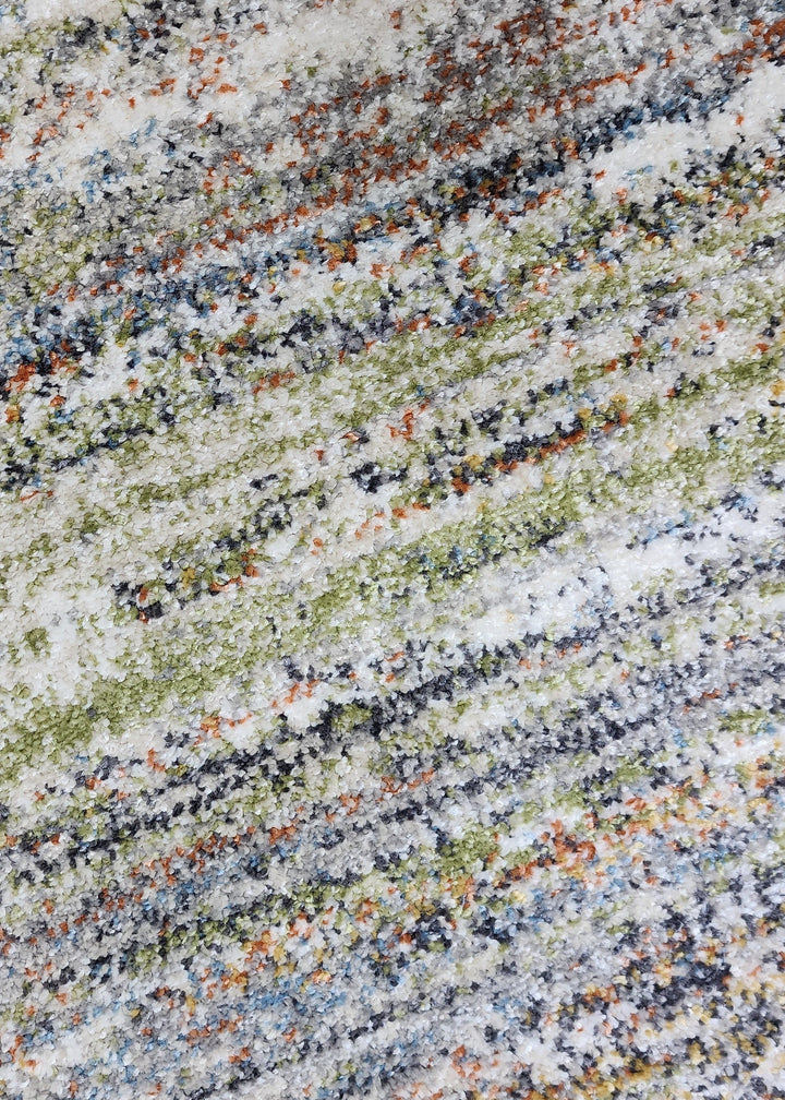 Close-up of a multicolored granite surface with a speckled pattern.