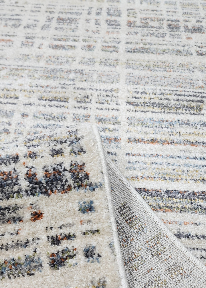 Textured area rug with a patterned design on a plain background
