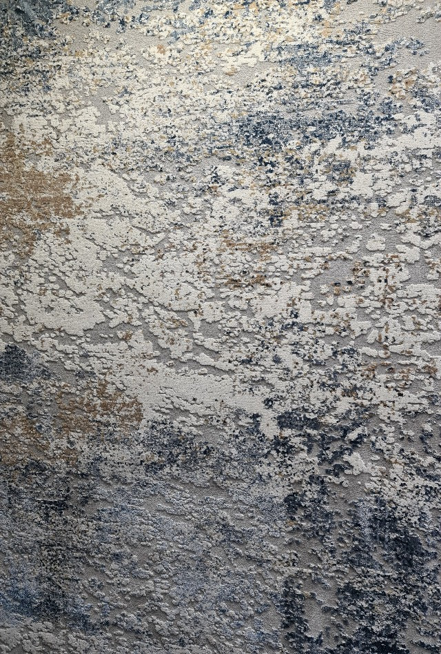 Close up of the colours in a  blue rug