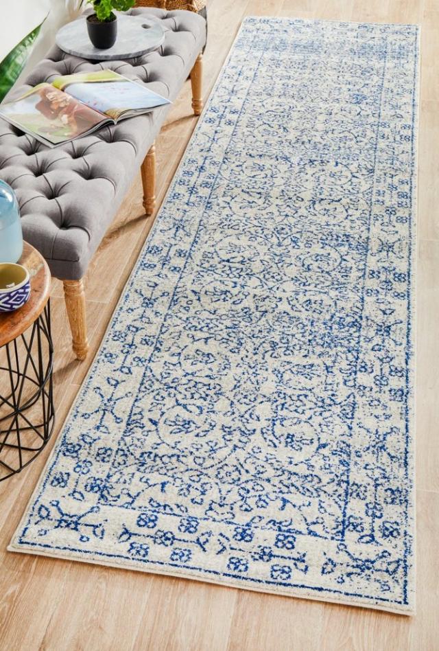 Evoke 258 White Rug with blue and grey highlights. Synthetic Machine Made Rug and Hall Runner comes in Extra Large Sizes