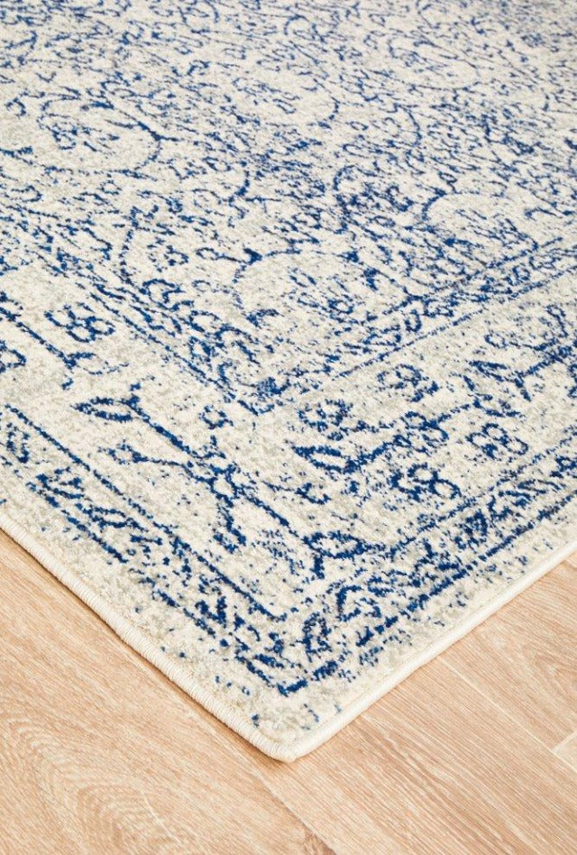 Evoke 258 White Rug with blue and grey highlights. Synthetic Machine Made Rug comes in Extra Large Sizes and Hall Runner
