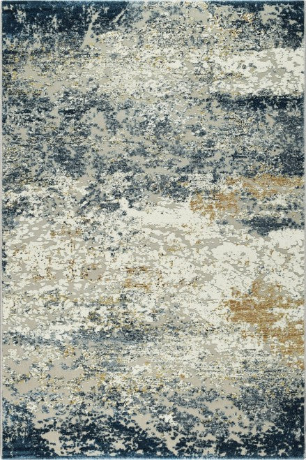 Over head of a rug with blue, beige and off white in it.