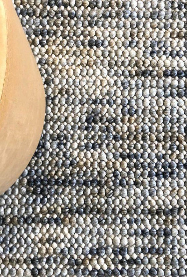 Magic Mineral Wool textured rug with wool loops knotted into a backing. Rug Addiction is a Stockist of The Rug Collection