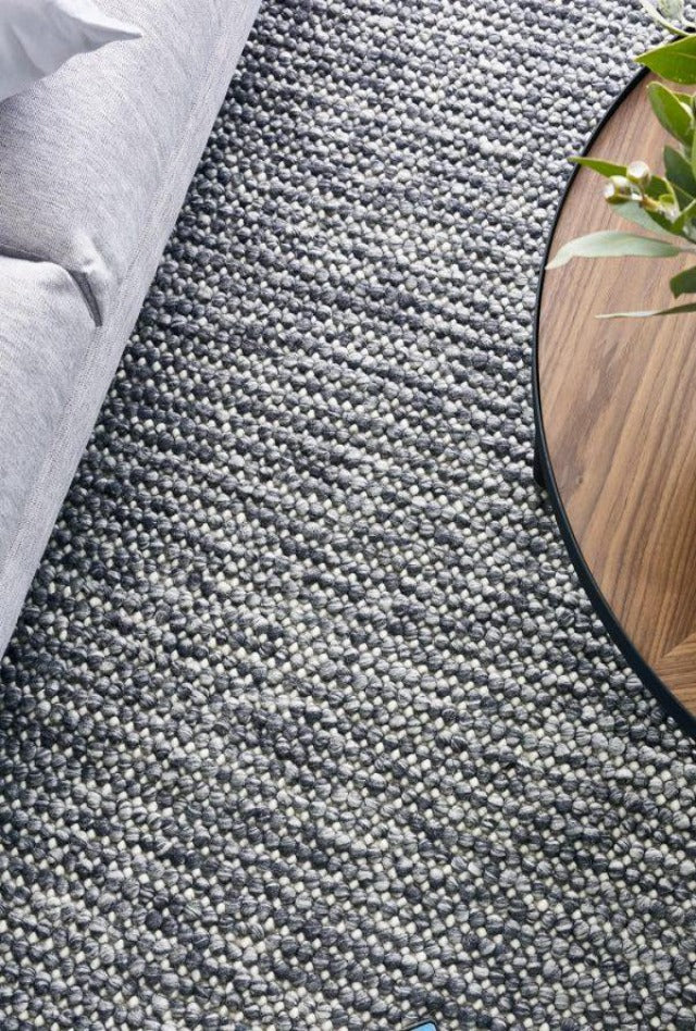 Magic Storm two tone greys and ivory blend handmade wool rug. knotted loops of wool adding texture finish